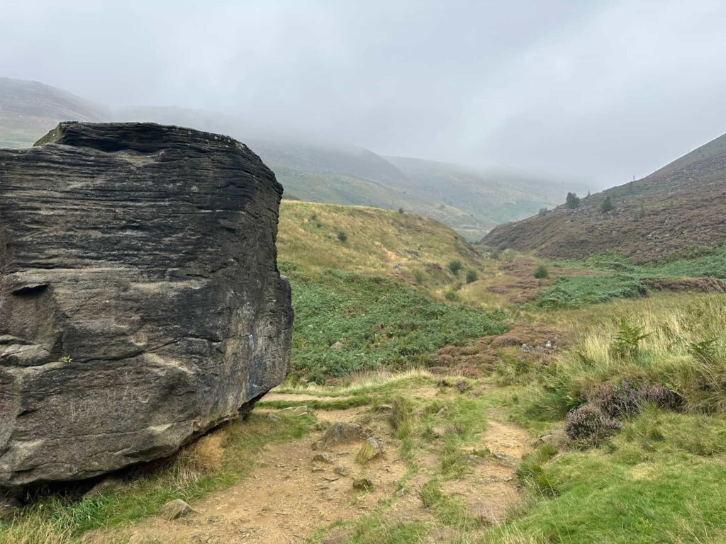 A large gritstone boulder in the Chew Valley