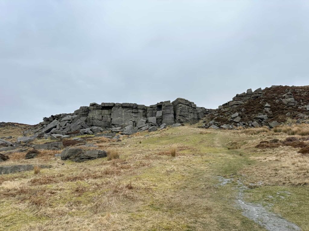 A rocky cliff face on the moors