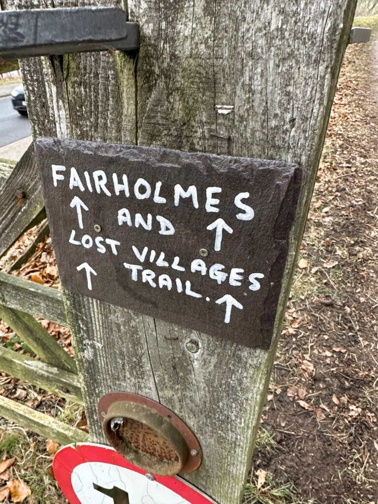 Small Sign Reading "Fairholmes and Lost Villages Trail"