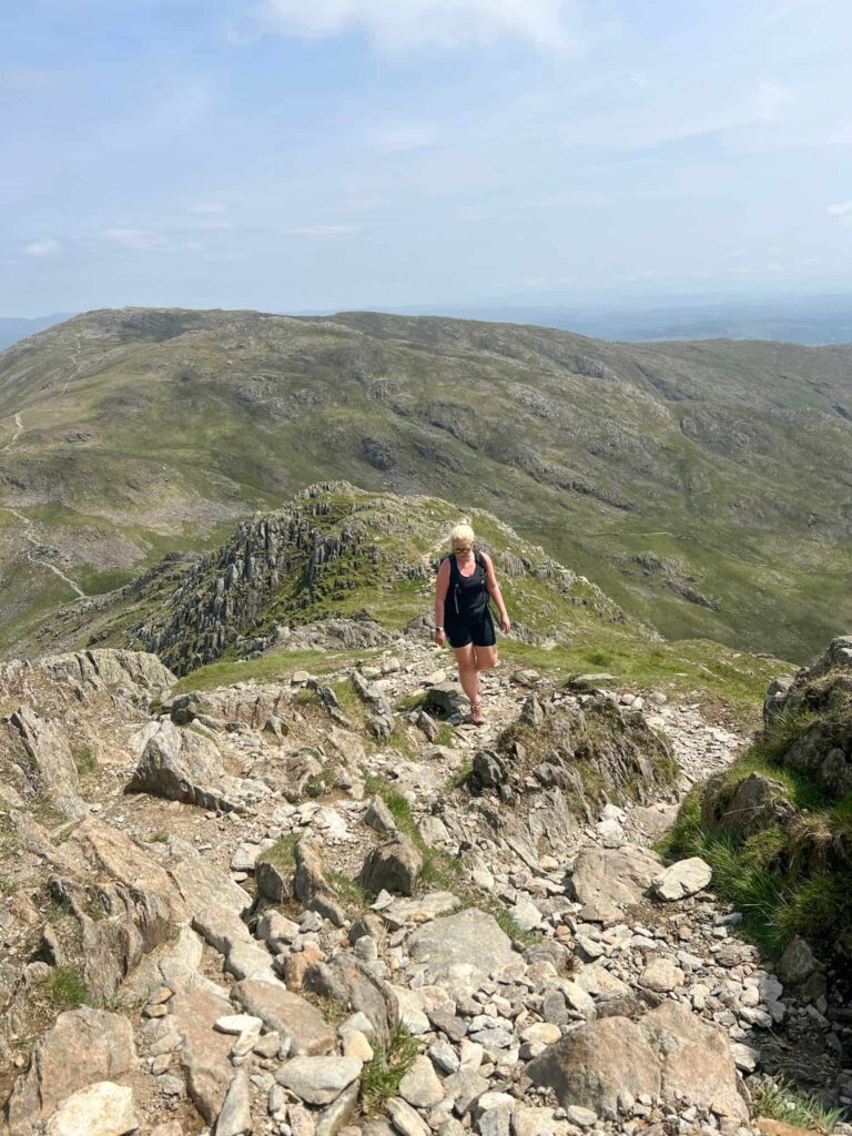 A woman climbing Swirl Hows