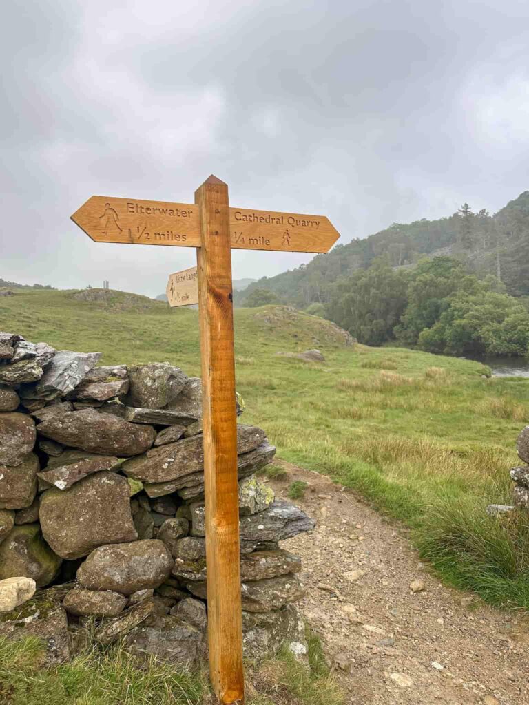 A wooden signpost to Cathedral Cave