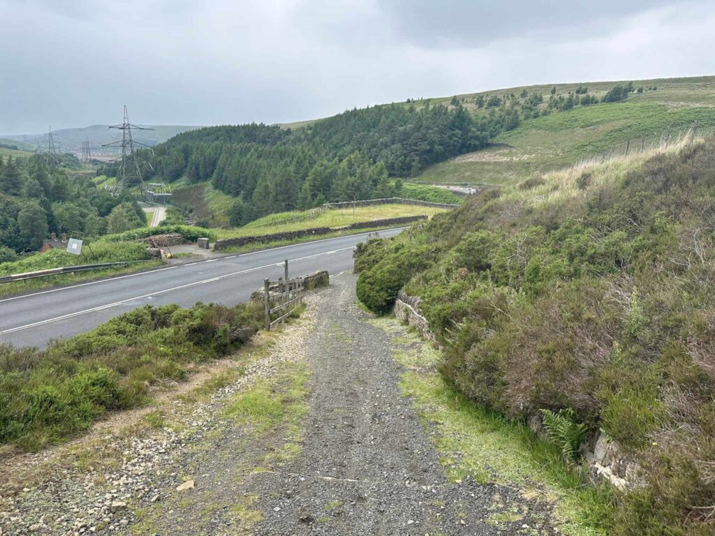 A gravel track leading to a road