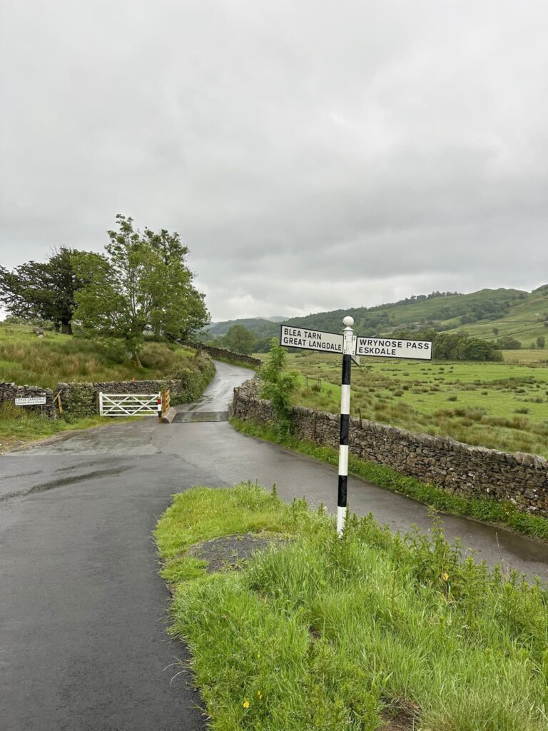 A classic black and white Lake District sign post