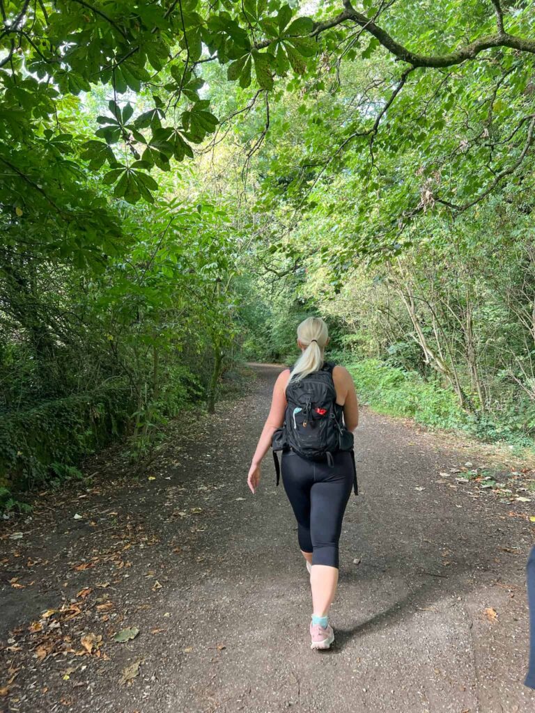 A woman walking on the Steel Cotton Rail Trail