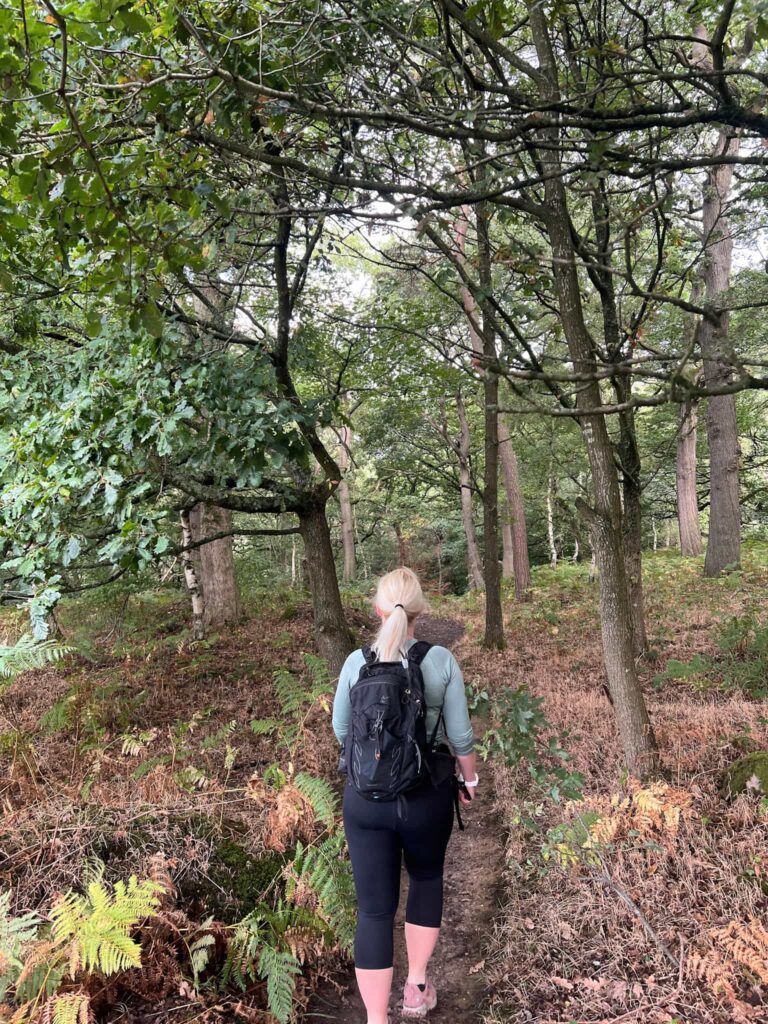 A woman walking in the woods
