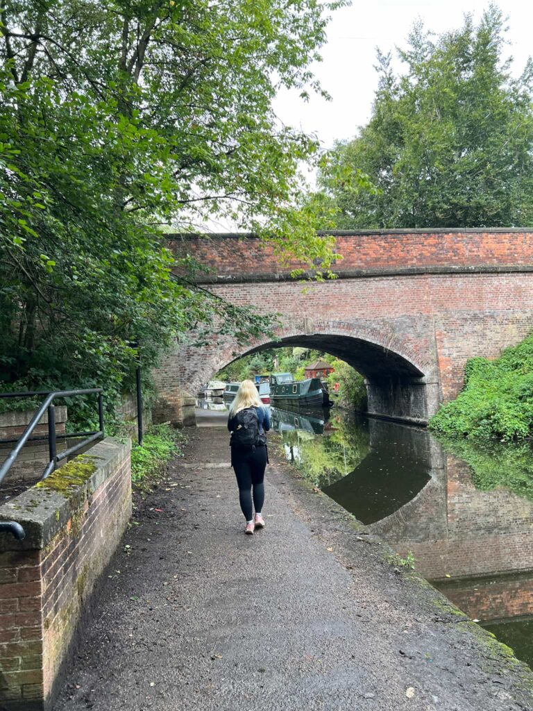 A woman walking on a canal