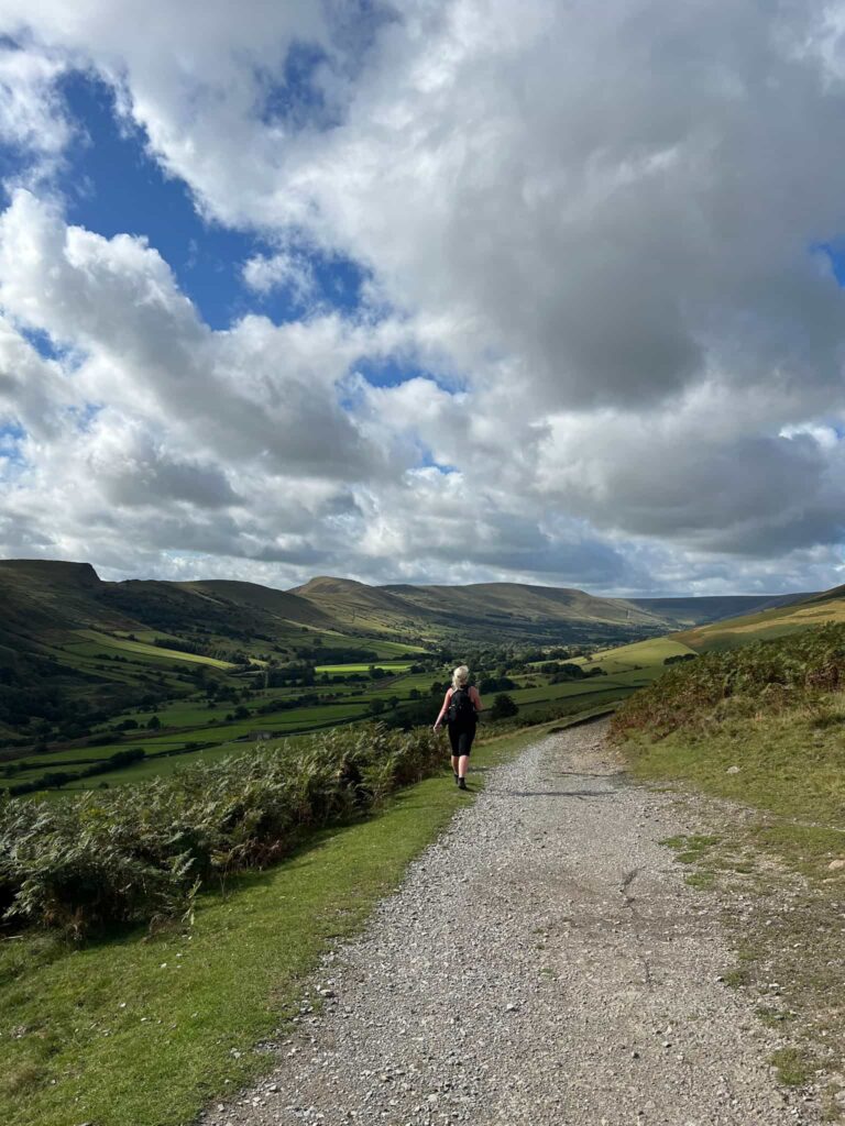 A woman walking in the Edale valley