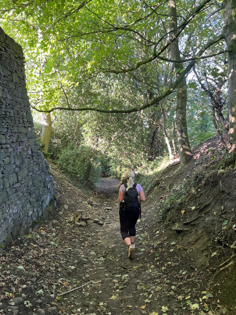 A woman walking through a wood