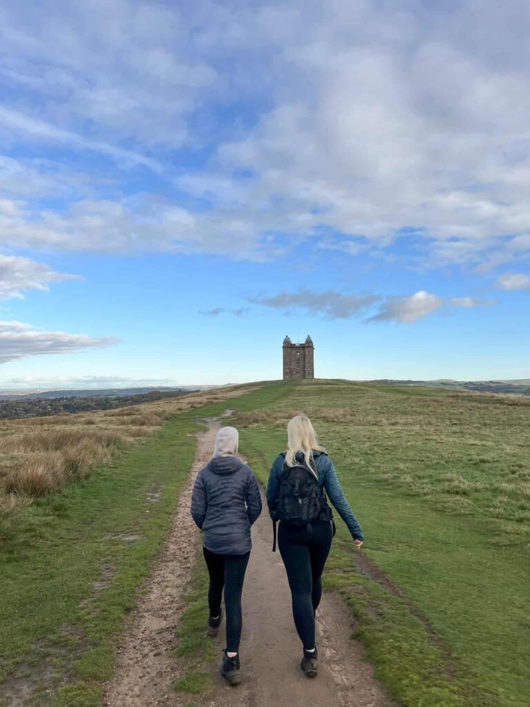 A woman and her daughter walking up the Cage at Lyme Park