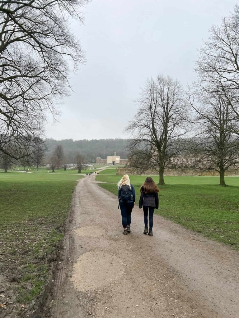 A woman and her daughter walking to Chatsworth House