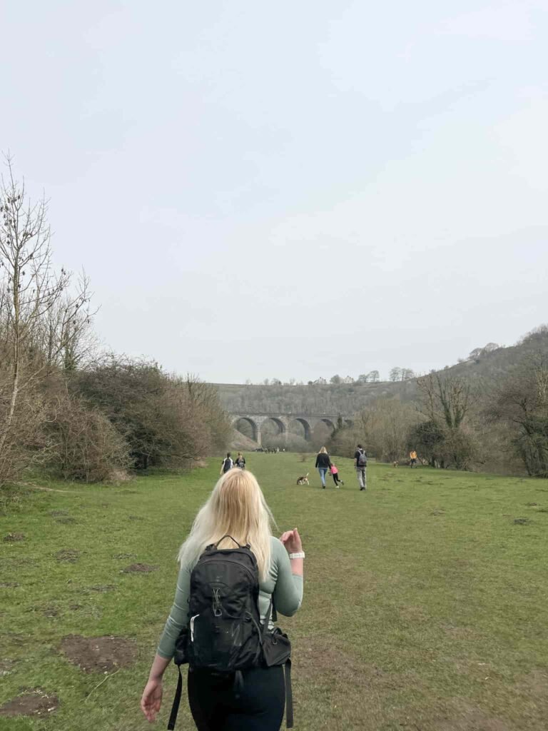 A woman walking towards Monsal Head