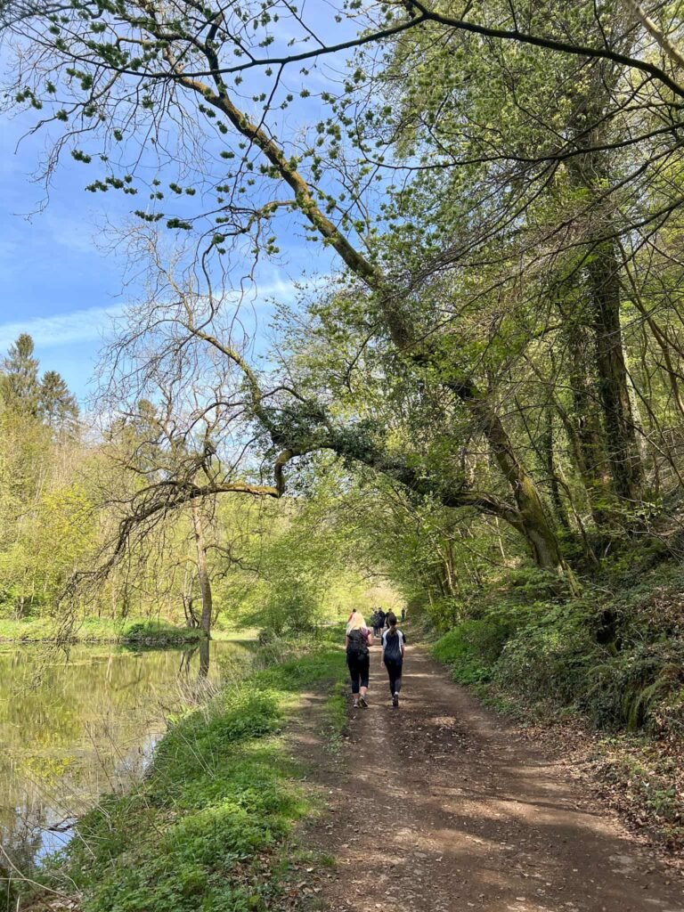 A woman and her daughter walking through Bradford Dale