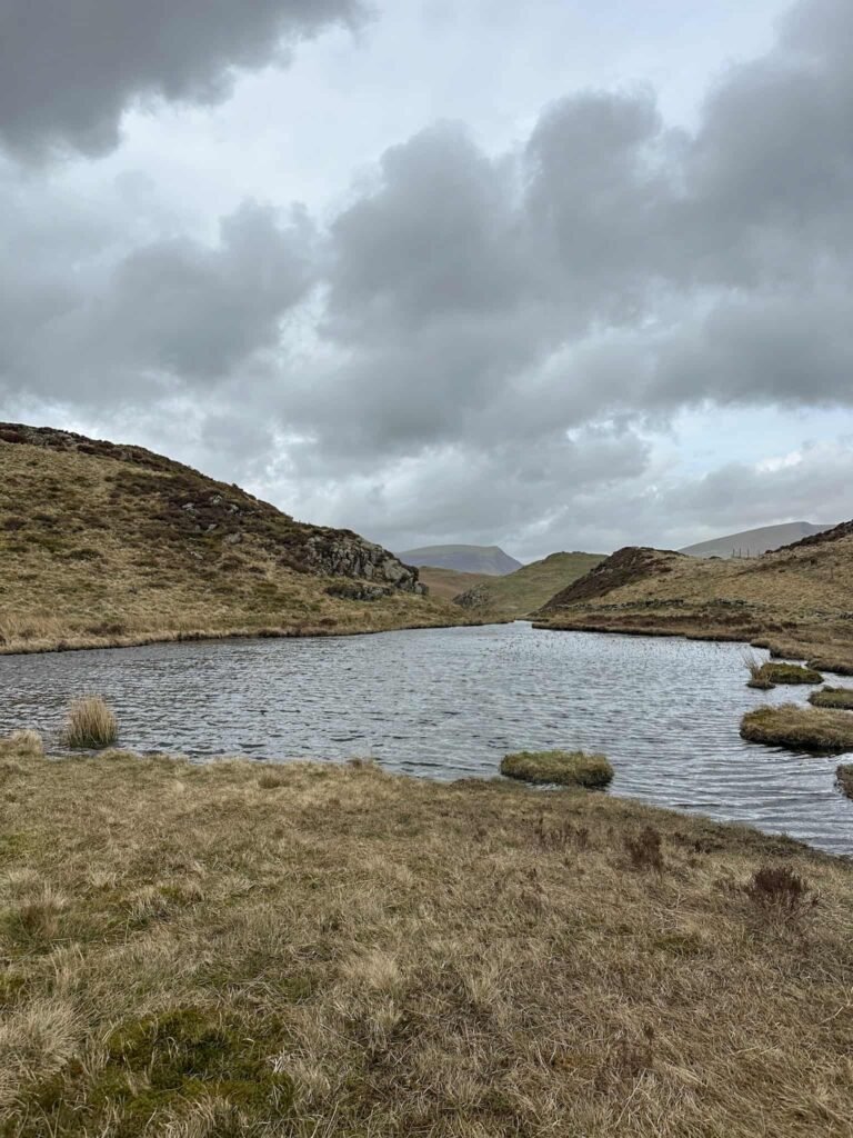 A small Lake District tarn near High Rigg