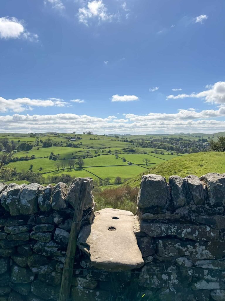 Looking over a stone stile at countryside