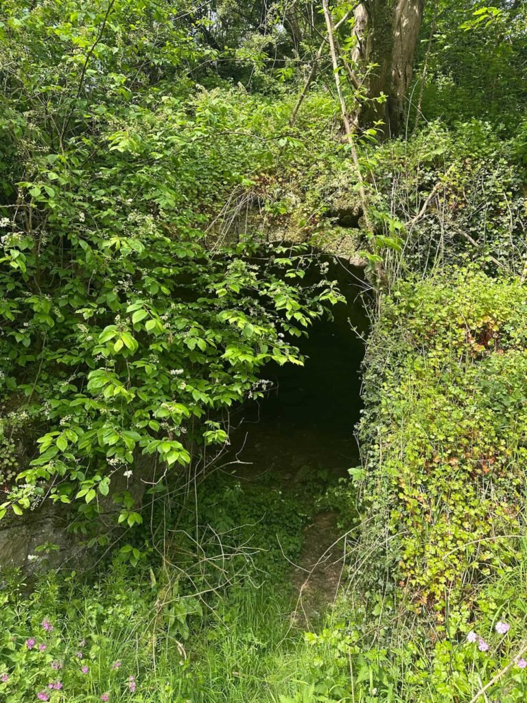 An old limekiln, which looks like a brick archway over a small cave