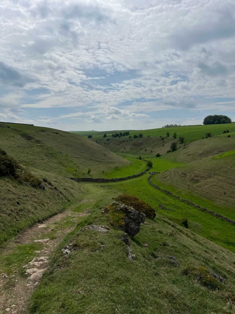 A view down a hillside into Long Dale, a grassy valley