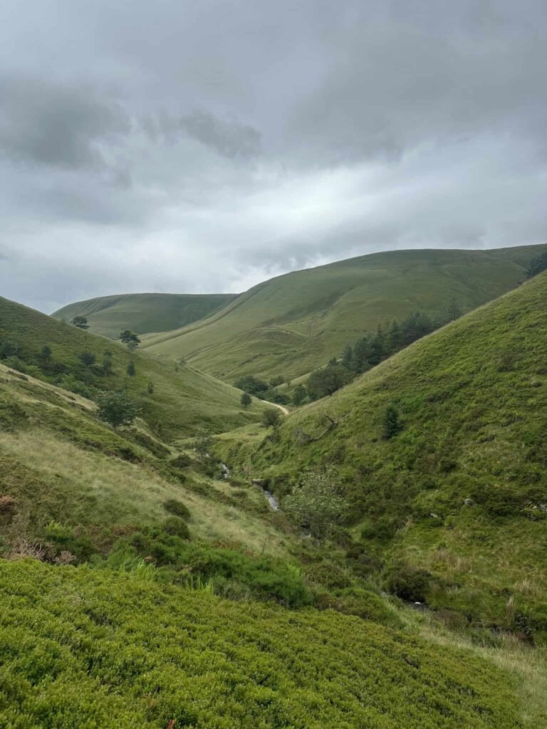 Looking down the lush green valley of the River Noe, Edale