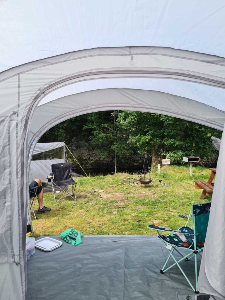 View from inside a tent onto a river bank