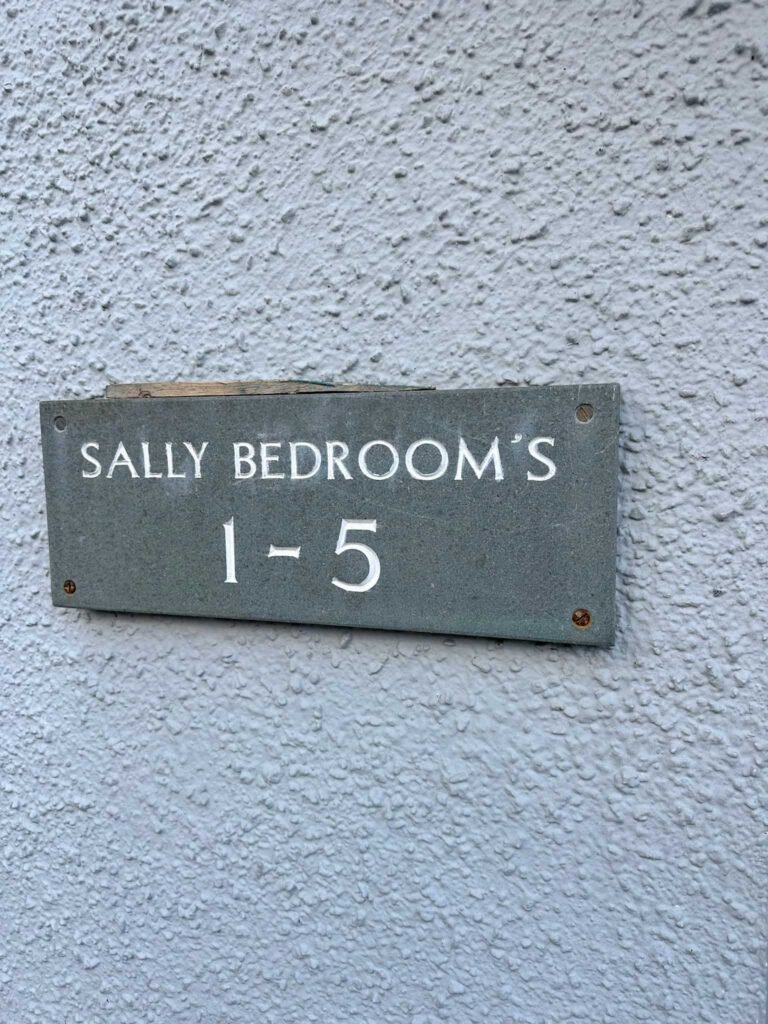A slate sign for Sally Bedrooms