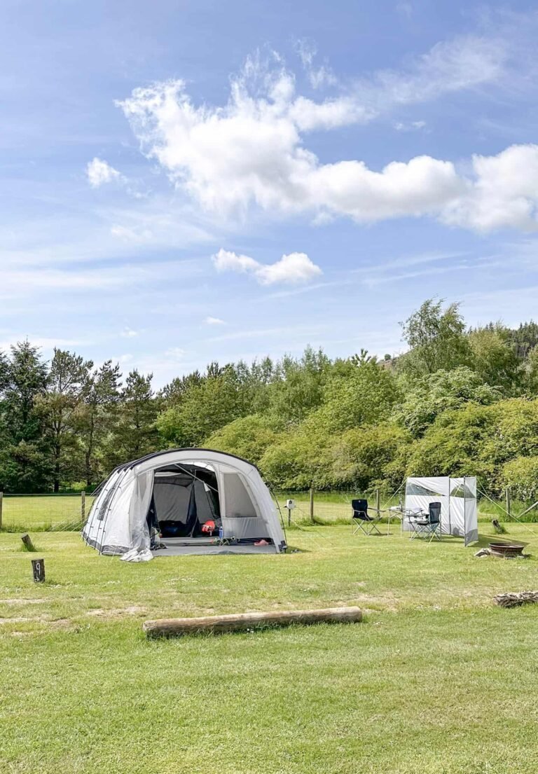 A grey tent on a campsite