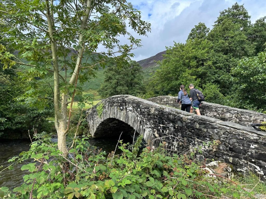 A picturesque stone bridge over the River Derwent in Rosthwaite