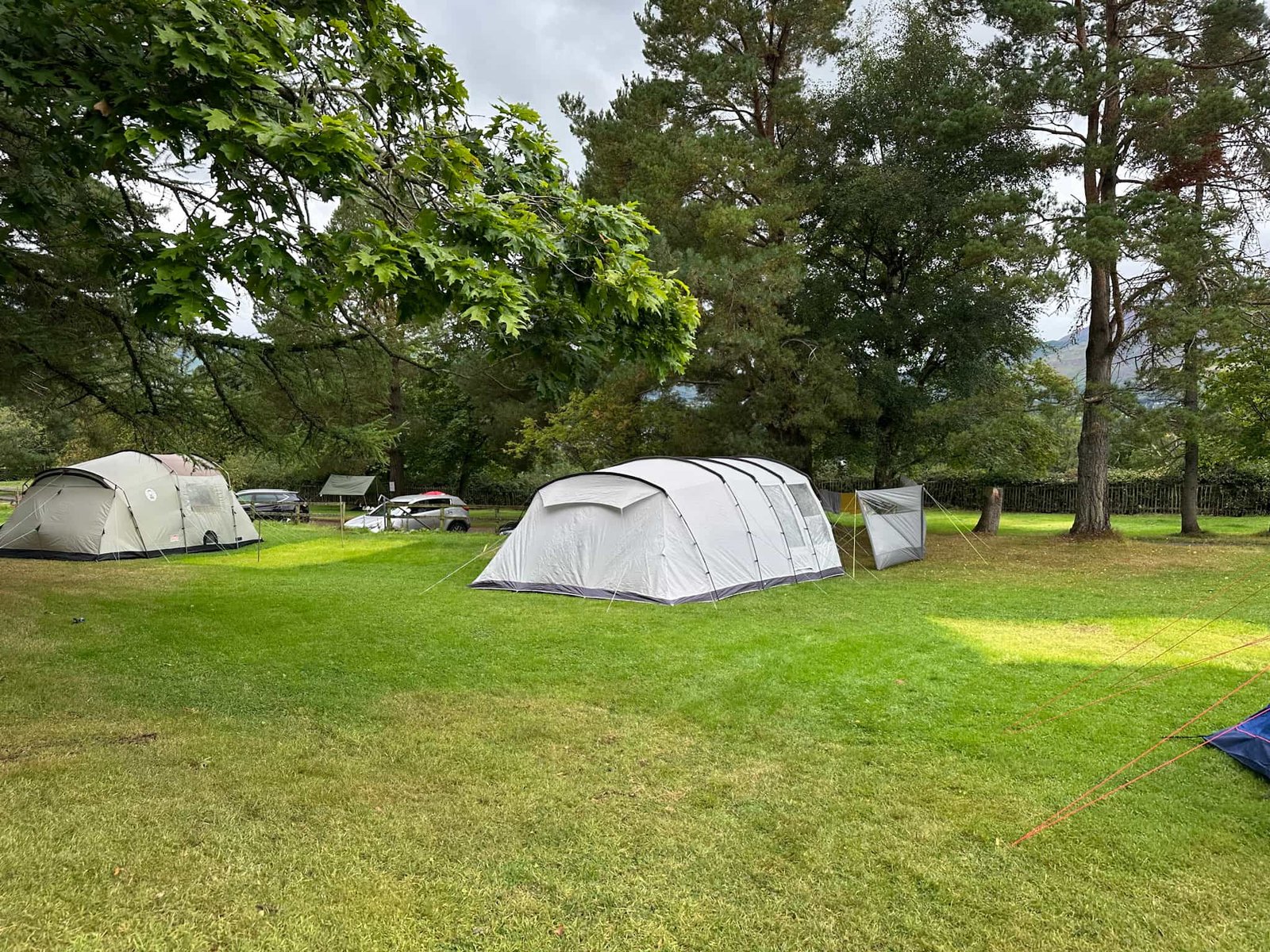 A grey tent in a camping field