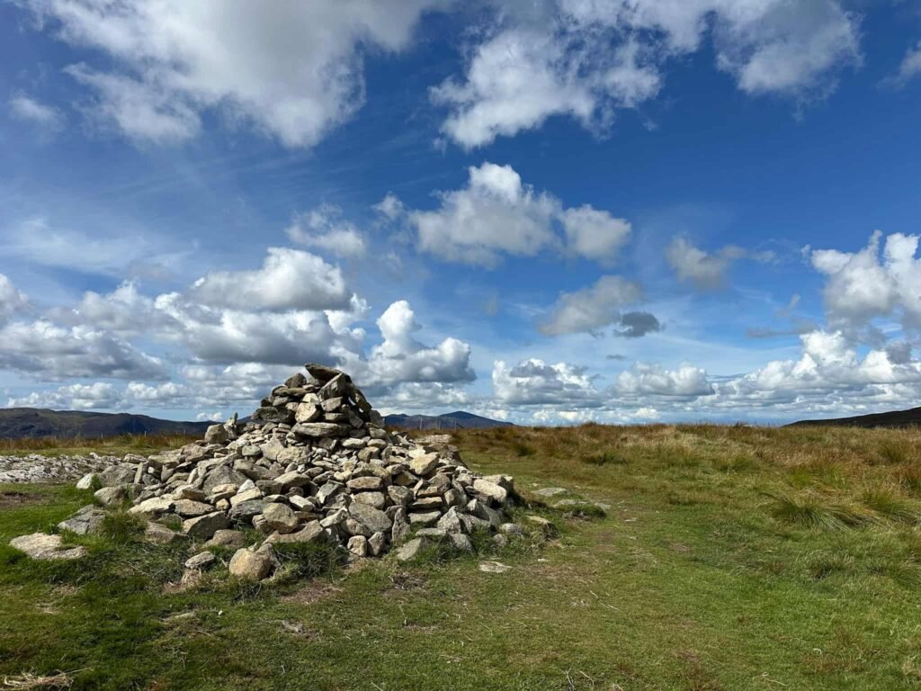 A pile of stones forming a summit cairn at High Tove