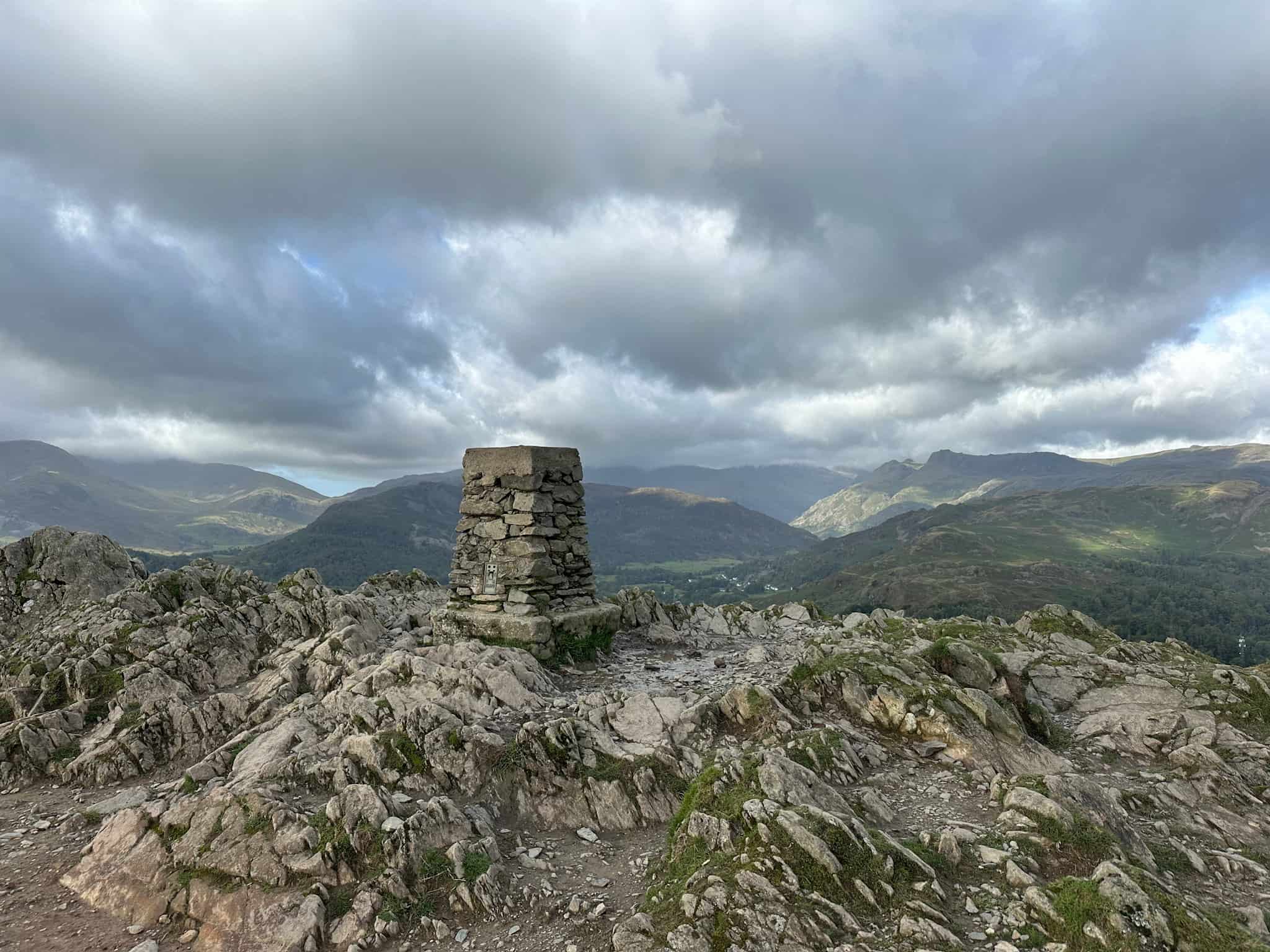 Loughrigg Fell trig point, a stone monument.