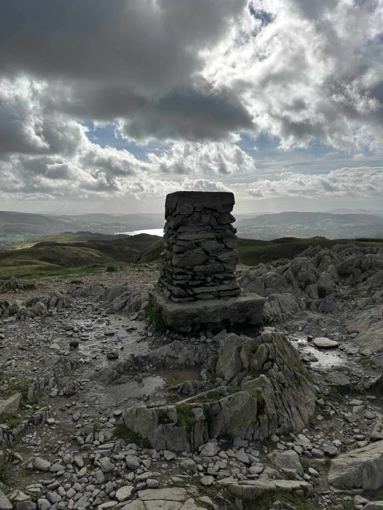 Loughrigg Fell trig point, a stone monument.