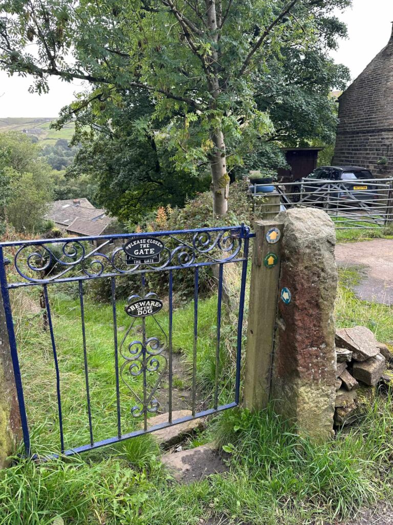 A blue metal garden gate