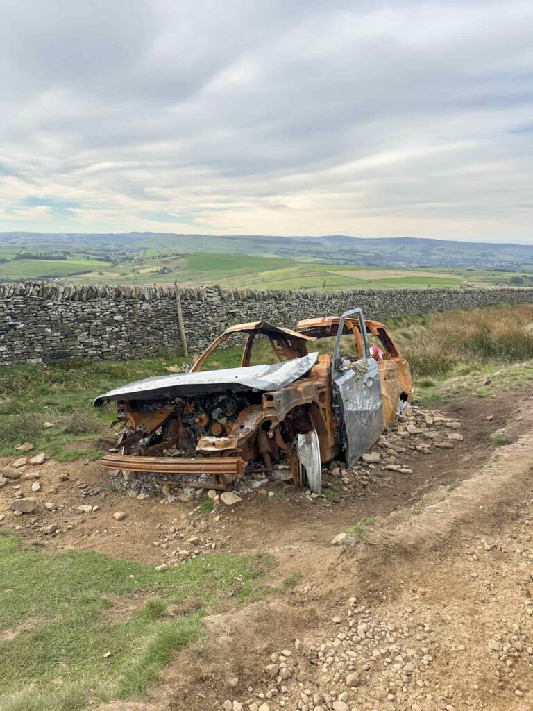 The wreck of a Range Rover on Rushup Edge
