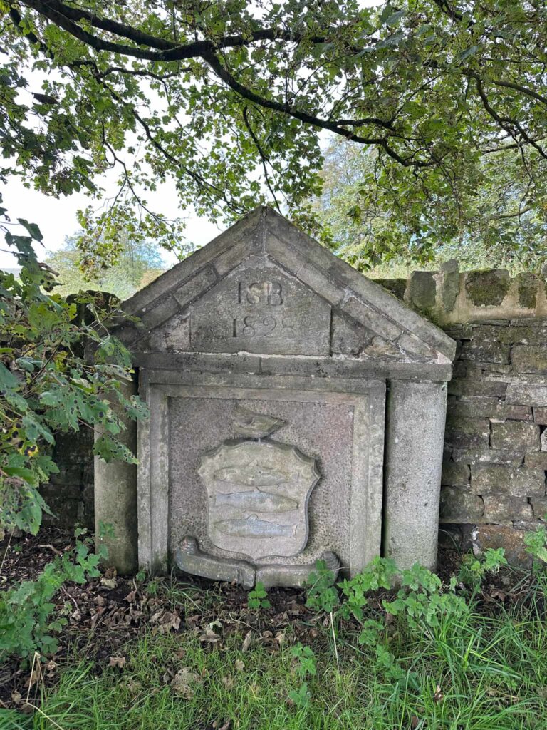 Stone carving from the former Grouse and Trout pub