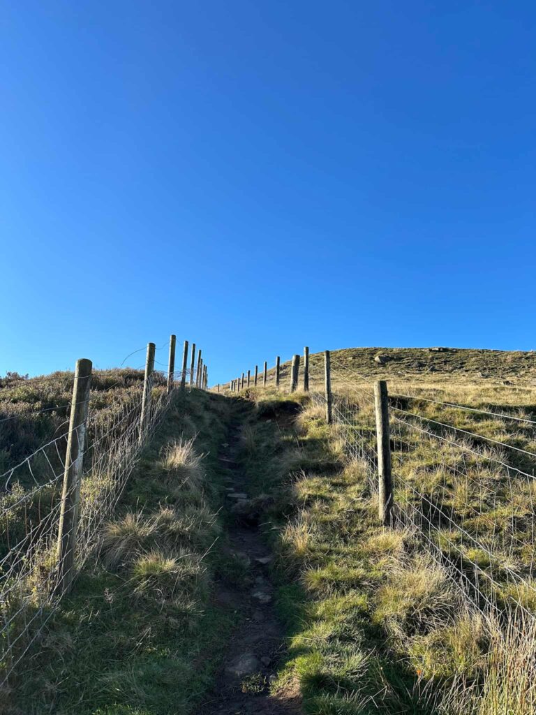 A path up onto the moors with a blue sky